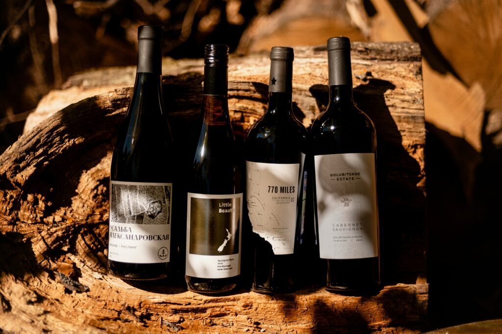 a group of wine bottles sitting on top of a wooden table