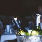 two liquor bottles in bucket