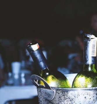 two liquor bottles in bucket